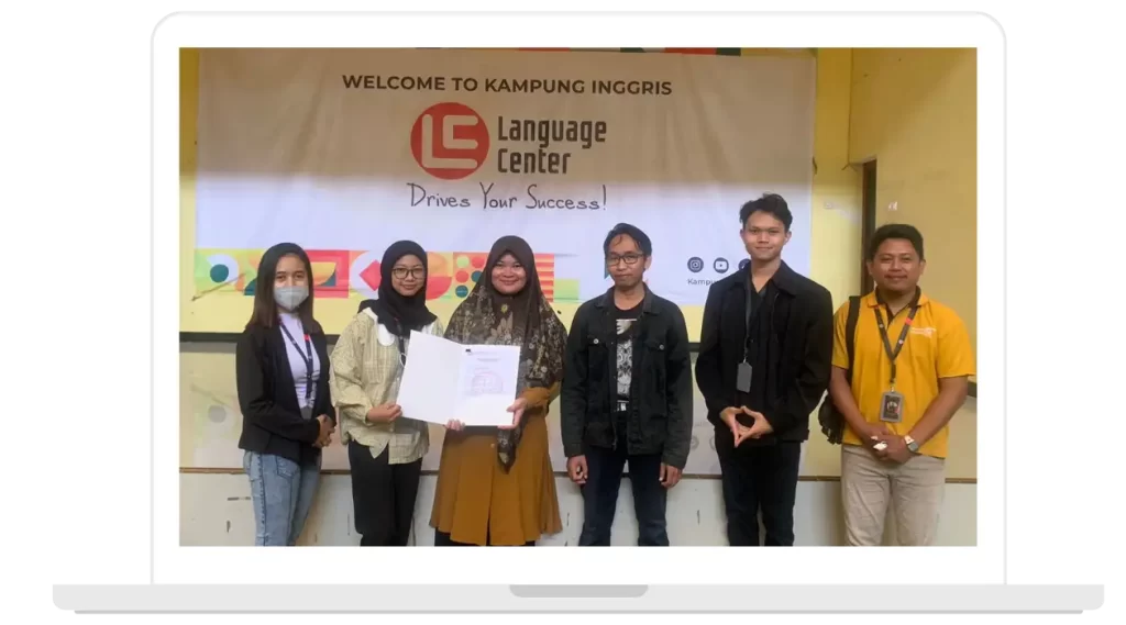 Group of six people posing with a certificate at the Kampung Inggris Language Center.
